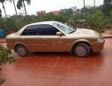 Ford Laser 2000 - Bán ô tô Ford Laser đời 2000, màu vàng như mới