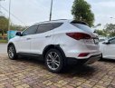 Hyundai Santa Fe 2016 - Cần bán gấp Hyundai Santa Fe sản xuất 2016, màu trắng số tự động, giá tốt