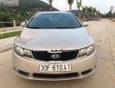 Kia Forte EX 1.6 MT 2011 - Cần bán Kia Forte EX 1.6 MT đời 2011, màu vàng, giá 295tr