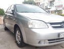 Daewoo Lacetti 2010 - Cần bán gấp Daewoo Lacetti đời 2010, màu bạc