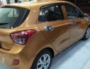 Hyundai Grand i10 1.0 MT Base 2014 - Cần bán xe Hyundai Grand i10 1.0 MT Base đời 2014, màu vàng, nhập khẩu chính chủ