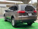 Mitsubishi Pajero Sport G 4x4 AT 2015 - Cần bán gấp Mitsubishi Pajero Sport G 4x4 AT sản xuất năm 2015, màu nâu chính chủ