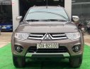 Mitsubishi Pajero Sport G 4x4 AT 2015 - Cần bán gấp Mitsubishi Pajero Sport G 4x4 AT sản xuất năm 2015, màu nâu chính chủ