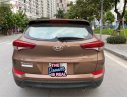 Hyundai Tucson 2.0 ATH 2015 - Cần bán lại xe Hyundai Tucson 2.0 ATH năm sản xuất 2015, màu nâu, xe nhập chính chủ