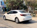 Mazda 3   2015 - Bán ô tô Mazda 3 1.5 AT đời 2015, màu trắng, giá cạnh tranh