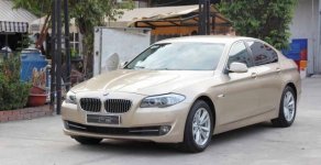 BMW 528i 2010 - Cần bán xe BMW 528i đời 2010, màu vàng giá 1 tỷ 350 tr tại Tp.HCM