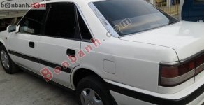 Mazda 323 1990 - Cần bán lại xe Mazda 323 1990, màu trắng, nhập khẩu chính hãng giá 66 triệu tại Tp.HCM