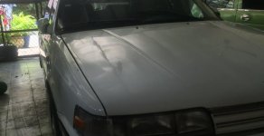 Mazda 323 1989 - Cần bán Mazda 323 đời 1989, màu trắng  giá 55 triệu tại Tp.HCM