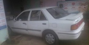 Mazda 323 1995 - Cần bán xe Mazda 323 đời 1995, màu trắng giá 50 triệu tại Bình Thuận  