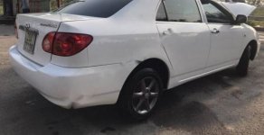 Toyota Corolla J  2002 - Cần bán Toyota Corolla J đời 2002, màu trắng giá 260 triệu tại Hà Nội