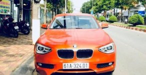 BMW 1 Series  116i  2014 - Chính chủ bán BMW 1 Series 116i đời 2014, màu cam giá 799 triệu tại Bình Dương