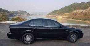 Daewoo Magnus 2004 - Bán xe Daewoo Magnus đời 2004, màu đen giá 145 triệu tại Hòa Bình