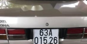 Toyota Corolla altis 2.0  1990 - Cần bán xe Toyota Corolla Altis 2.0 năm sản xuất 1990, màu ghi vàng giá 105 triệu tại Bình Dương