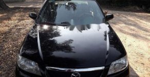 Mazda 323 2004 - Cần bán lại xe Mazda 323 2004, màu đen chính chủ, 139tr giá 139 triệu tại Bình Định