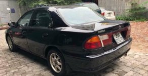 Mazda 323 1999 - Bán ô tô Mazda 323 đời 1999, màu đen còn mới, giá 88tr giá 88 triệu tại Hải Dương