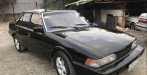 Mazda 626 1986 - Cần bán gấp Mazda 626 đời 1986, màu đen, xe nhập còn mới giá 35 triệu tại Tp.HCM