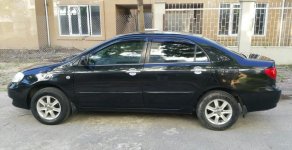 Toyota Corolla altis G 2004 - Gia đình bán ô tô Toyota Corolla altis G đời 2004, màu đen giá 265 triệu tại Hà Nội