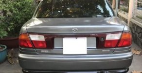 Mazda 323 1999 - Cần bán xe Mazda 323 đời 1999, màu xám, nhập khẩu nguyên chiếc giá 120 triệu tại Tiền Giang