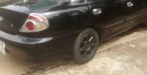 Kia Spectra   2003 - Cần bán gấp Kia Spectra đời 2003, màu đen, phun xăng giá 85 triệu tại Lâm Đồng