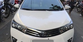 Toyota Corolla altis MT 2015 - Gia đình cần bán xe Altis 2015, số sàn, màu trắng, gia đình sử dụng giá 574 triệu tại Tp.HCM