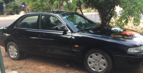 Mazda 626 LX 1997 - Cần bán xe Mazda 626 LX năm sản xuất 1997, màu đen giá 80 triệu tại Bình Định