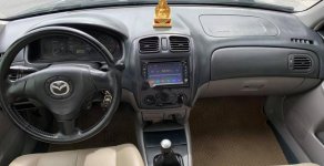 Mazda 323 2003 - Cần bán xe Mazda 323 đời 2003, màu đen, xe đẹp  giá 160 triệu tại Tuyên Quang