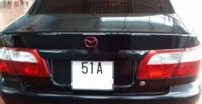 Mazda 626 2001 - Chính chủ bán Mazda 626 sản xuất năm 2001, màu đen giá 160 triệu tại Tp.HCM