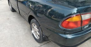 Mazda 323 1.6 MT 1999 - Cần bán gấp Mazda 323 1.6 MT năm 1999, màu xanh lam giá 95 triệu tại Hà Nội