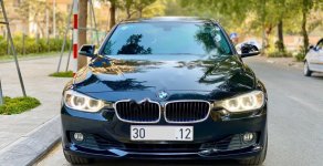 BMW 3 Series 320i 2014 - Bán xe BMW 3 Series 320i sản xuất năm 2014, màu đen, xe nhập, 850 triệu giá 850 triệu tại Hà Nội