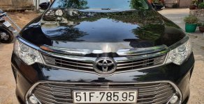 Toyota Camry 2016 - Cần bán lại xe Toyota Camry sản xuất năm 2016, màu đen mới 98%, giá chỉ 895 triệu giá 895 triệu tại Tp.HCM