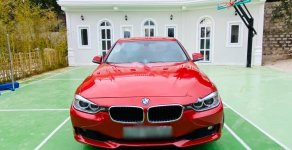 BMW 3 Series 2012 - Cần bán BMW 3 Series 320i đời 2012, màu đỏ, nhập khẩu nguyên chiếc xe gia đình giá 690 triệu tại Tp.HCM