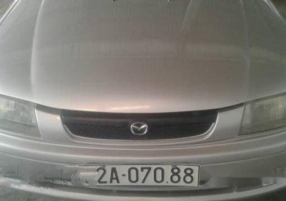 Mazda 323  MT 1999 - Bán Mazda 323 MT đời 1999, màu bạc số sàn