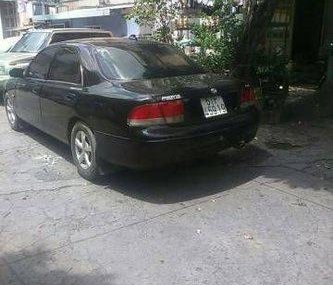 Mazda 626  MT 1996 - Bán xe Mazda 626 MT đời 1996, màu đen số sàn