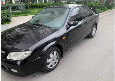 Mazda 323   2004 - Cần bán xe Mazda 323 đời 2004, màu đen, xe gia đình